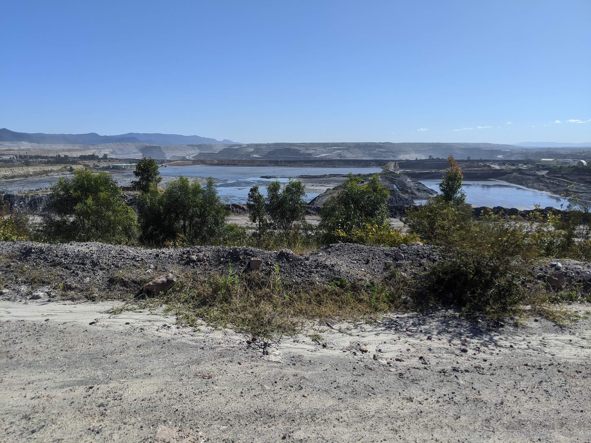 A huge open cut mine, flooded with the recent rain, perhaps 5km across.