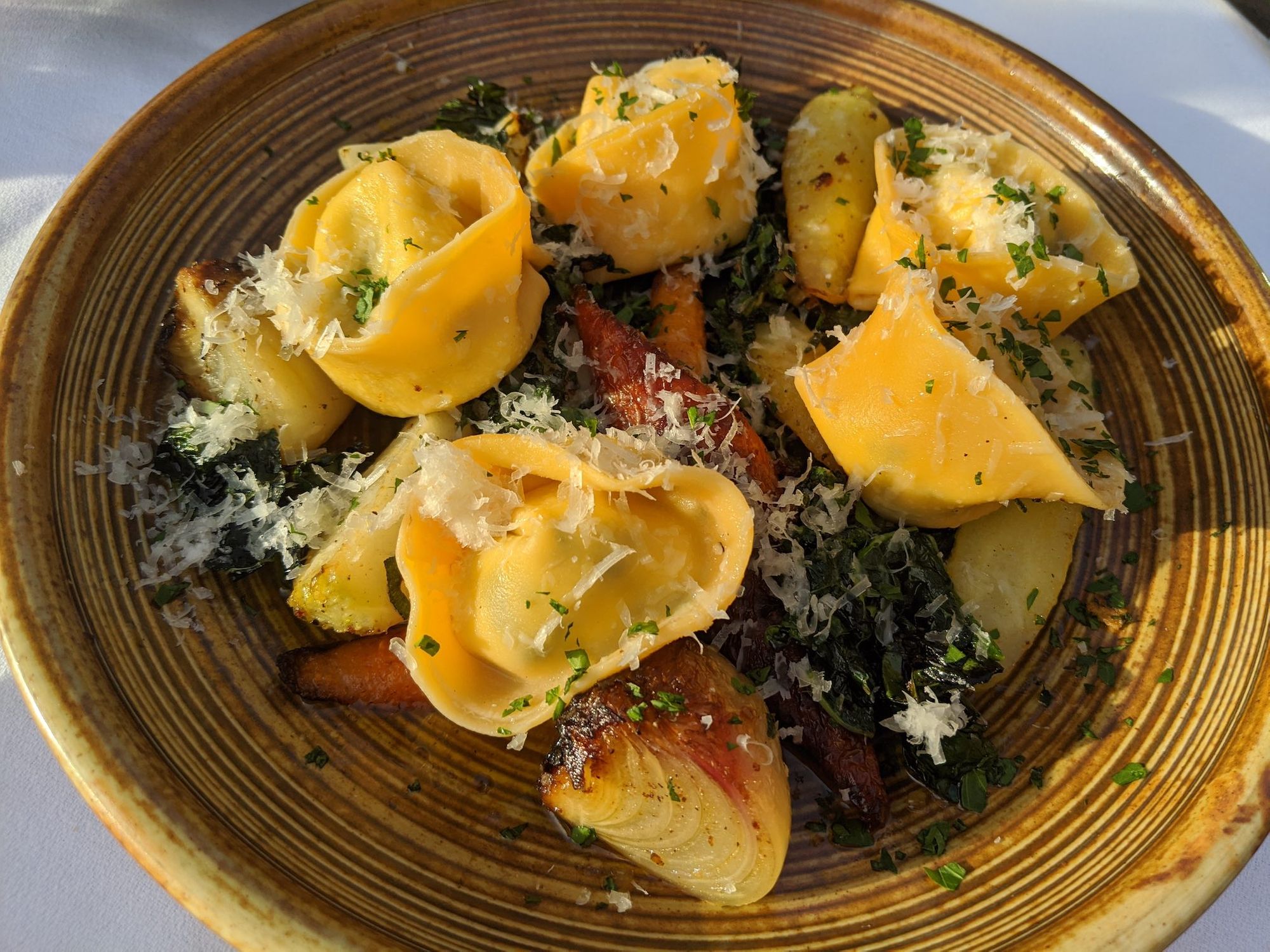 Tortellini pasta, onions, carrots, with lots of parmesan.