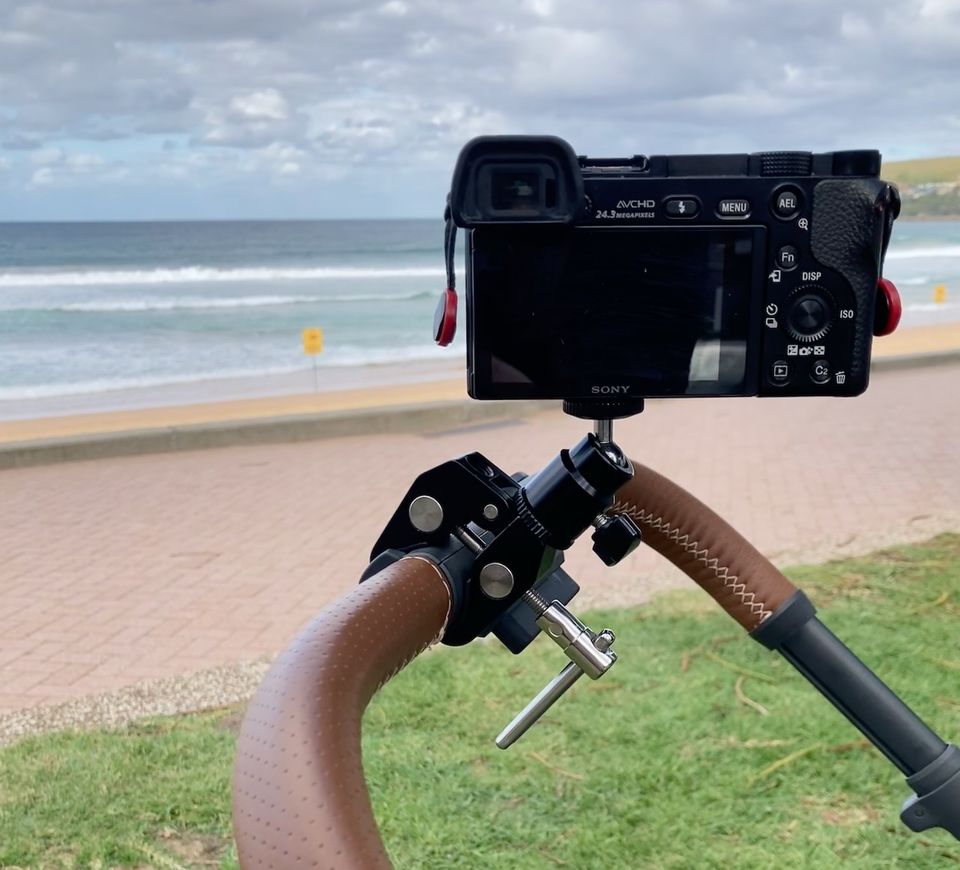 Camera attached to pram with clamp and ball joint, pointed at Manly Beach.